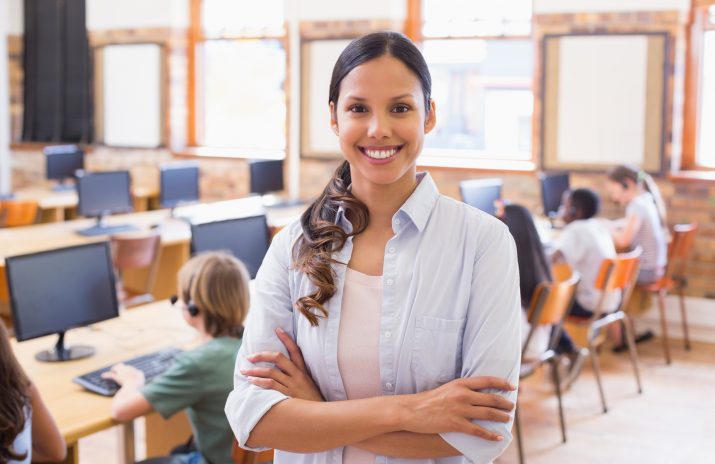 Young pretty teacher standing in a computer room The Financial Educator’s Guide to CentSai Education